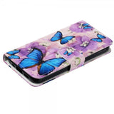 iPhone 15 Plus Cover Motiv Lilla Blomster Blå Sommerfugle